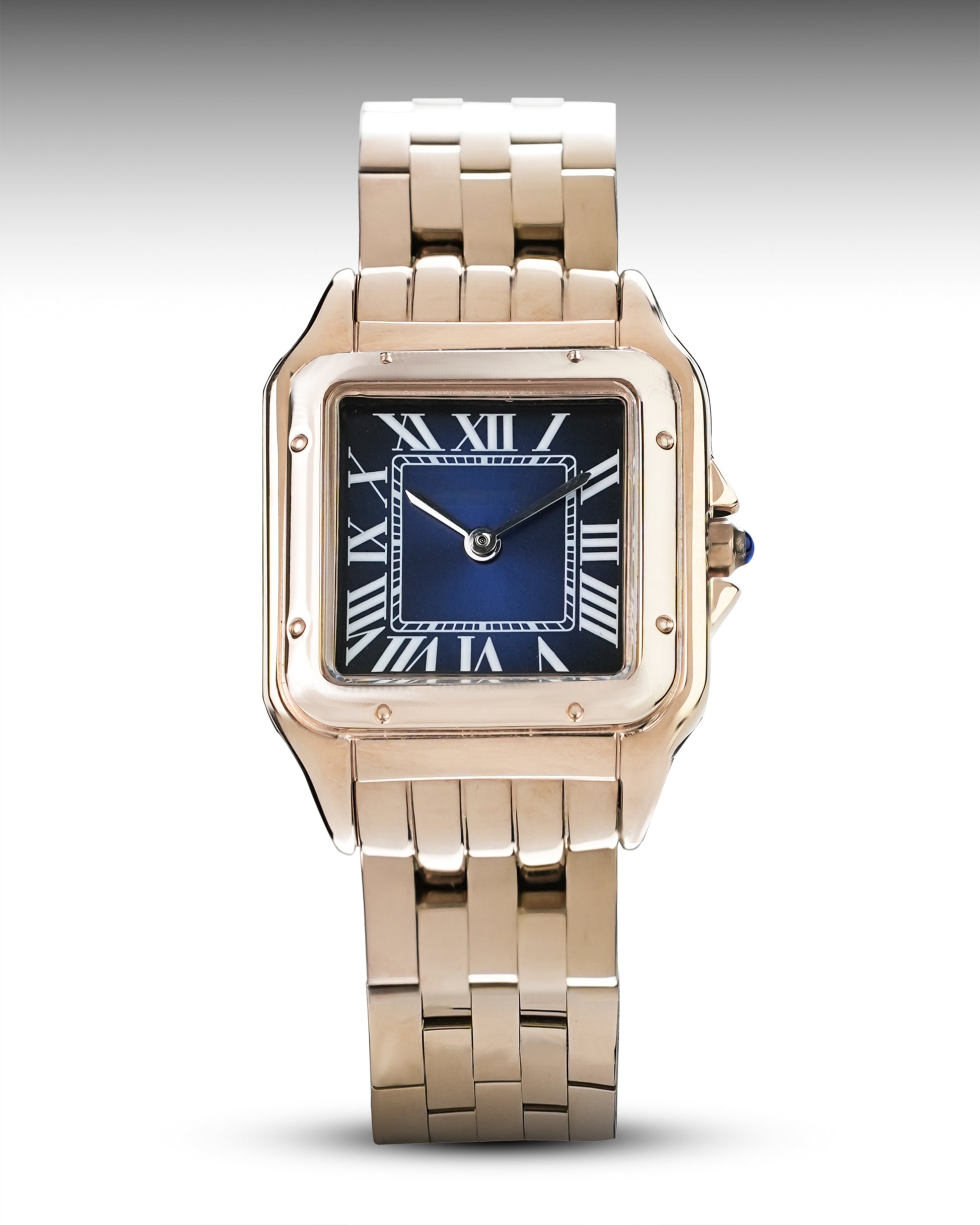 Rose gold watch with blue face on a white background
