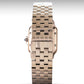 Rose gold watch with a metallic band on a white background