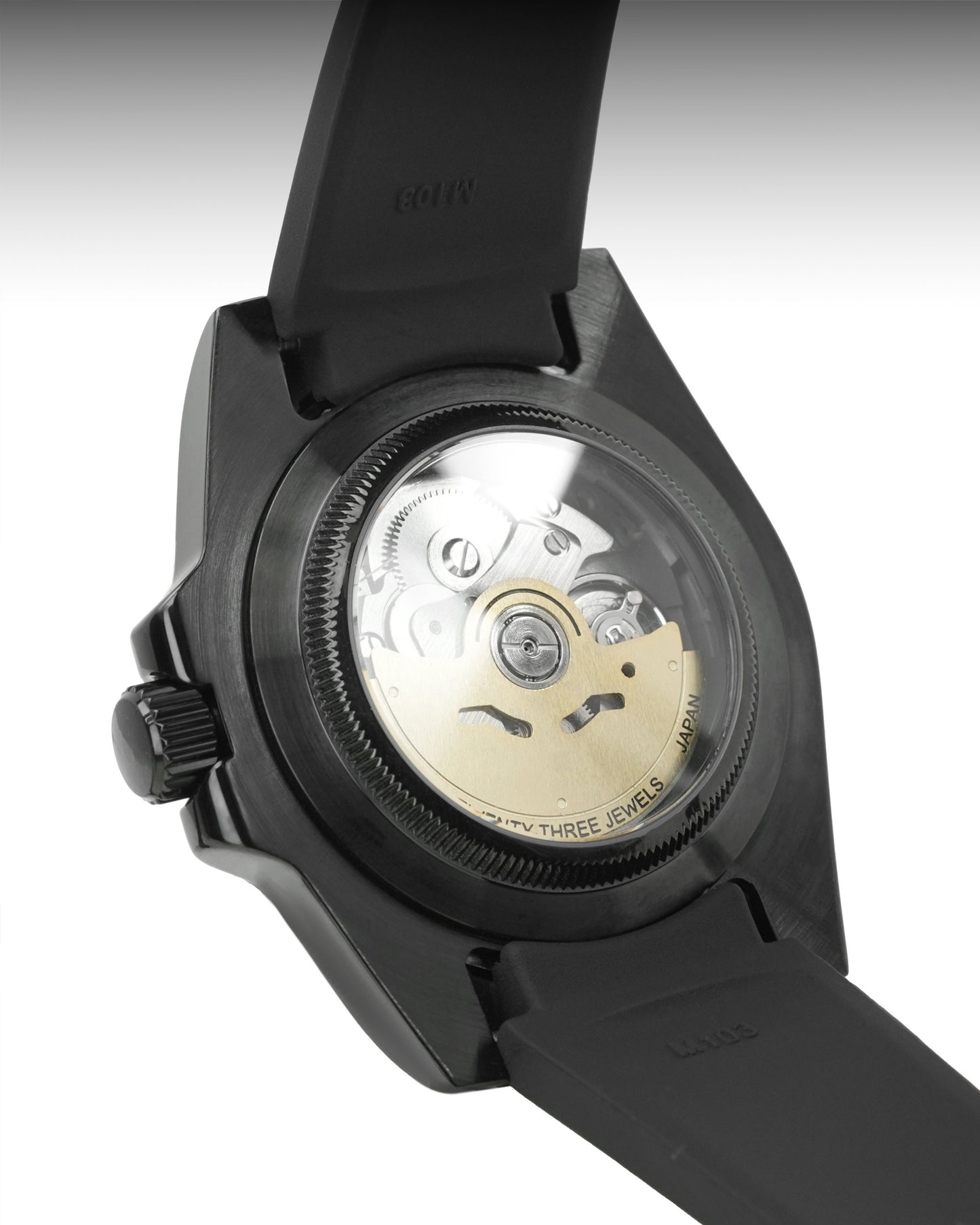 Close-up of a black watch with mechanical components visible